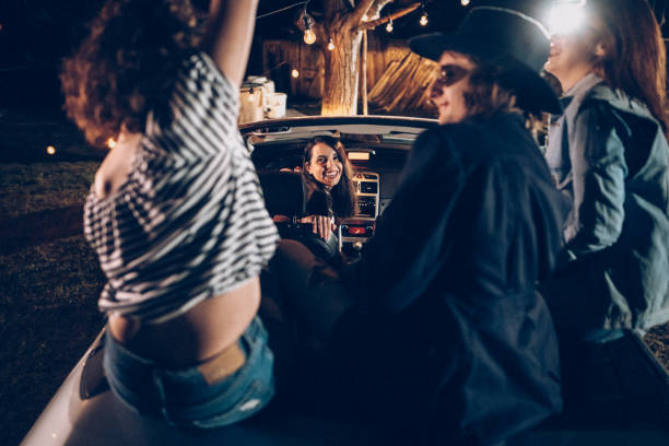 istock Wild party in car with opened roof 953642458