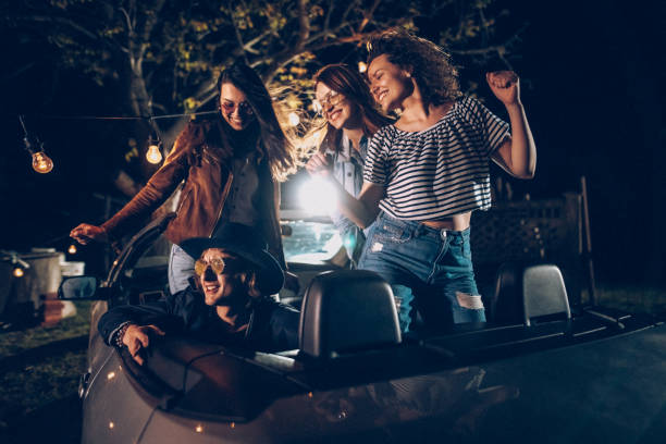 istock Young people having party in convertible 953642746