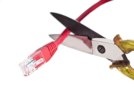 Plumber tools isolated. Closeup of a red PVC pipe cutter for cutting plastic pipes isolated on a white background. Clipping path. Macro. Craftsman tools.