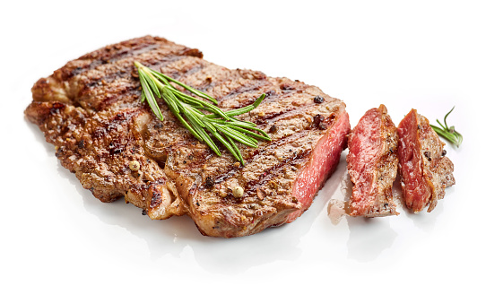 grilled spicy beef steak isolated on white background