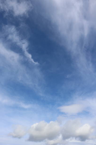 istock Close up of fluffy white clouds against blue sky 953650514