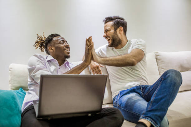 istock the two men sit together on the couch and talk 953650824