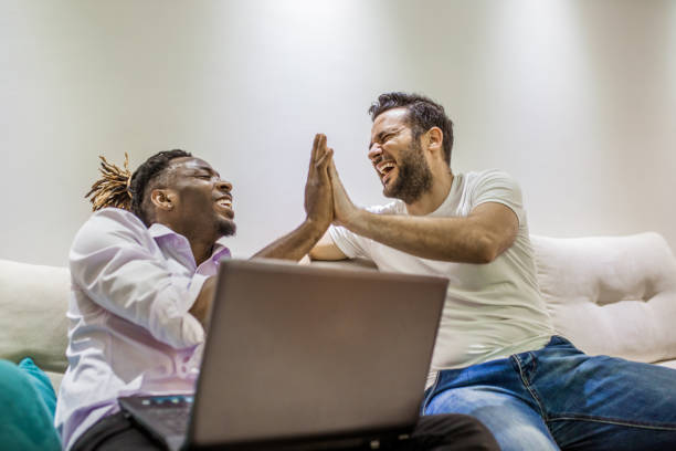 istock the two men sit together on the couch and talk 953650828