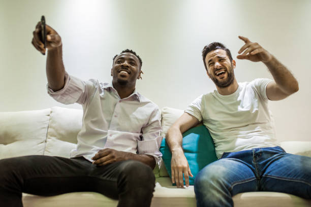 istock the two men sit together on the couch and talk 953650970