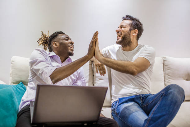 istock the two men sit together on the couch and talk 953651000
