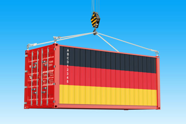 istock Cargo container with German flag hanging on the crane hook against blue sky, 3d rendering 953651738