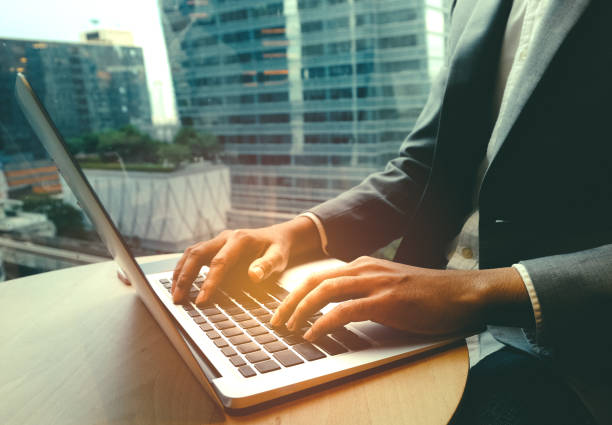 istock Young businessman multitasking using laptop.Business technology lifestyle. 953654924