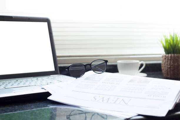 istock newspaper over office desk 953655034