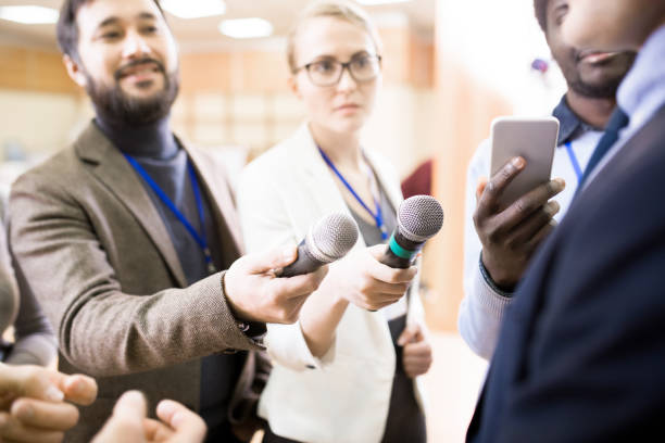 istock Reporters Holding Microphones 953657006