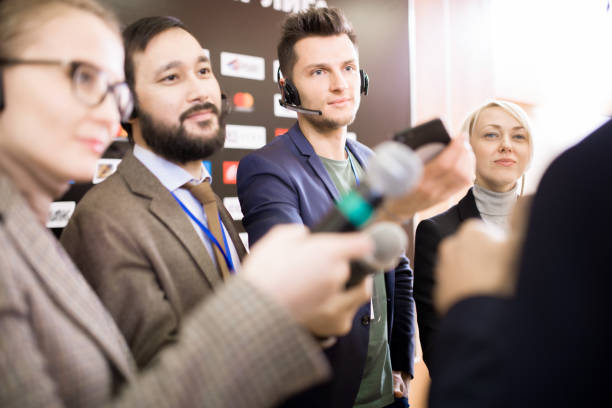 istock Group of Reporters with Microphones 953658084
