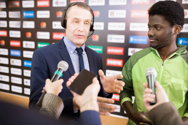 istock Reporters Interviewing African-American Man 953658090