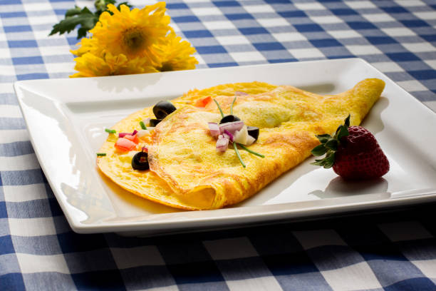 Fancy Gourmet Low Carb Onion Spinach and Tomato Omelet Gourmet omelet with onion, tomato and spinach and cheese.  This is a perfect ketogenic diet low carb breakfast goodfood stock pictures, royalty-free photos & images