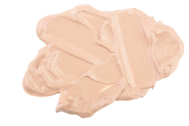 istock Beige liquid foundation makeup isolated on white background 953660010