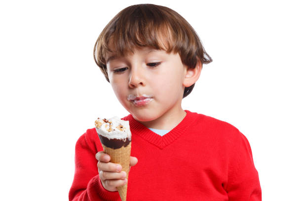 istock Licking ice cream lick child kid eating summer isolated 953660812