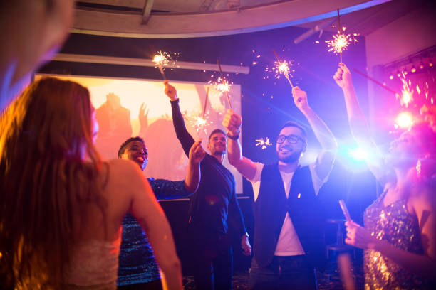 istock Young People with Sparklers at Awesome Party 953665878