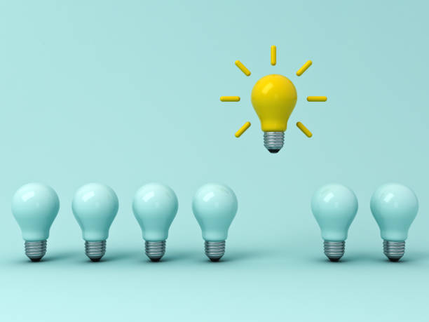 istock Think different concept , One yellow idea bulb standing out from the dim unlit light bulbs on blue pastel background with shadows , leadership and individuality creative idea concepts . 3D rendering 953668720