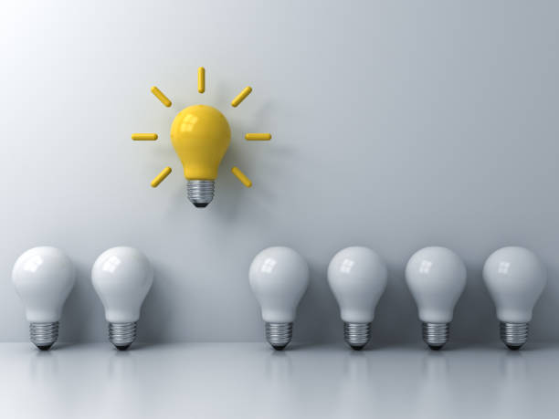 istock Think different concept , One yellow idea light bulb standing out from the white unlit bulbs with window reflections and shadows, leadership and individuality creative idea concepts . 3D rendering 953668764