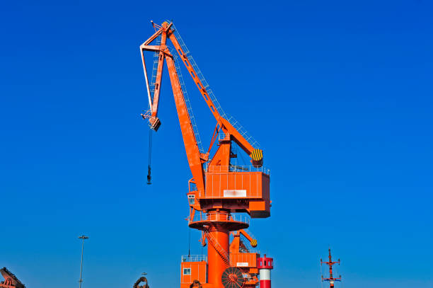 istock Port crane bridge and bulk carrier 953677138