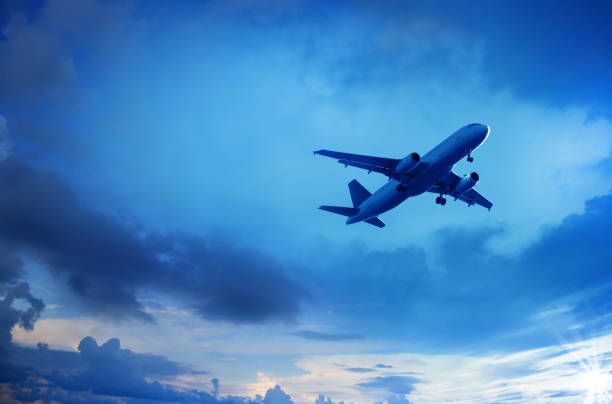 istock flying commercial passenger airplane over cloudy sky 953678790