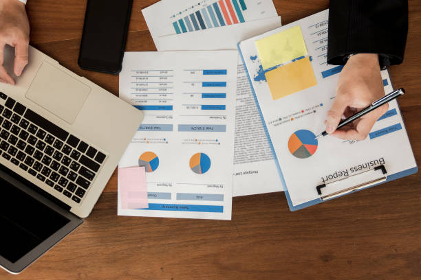 istock young businessman working with mobile laptop and documents in office, business concept 953679466