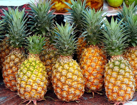 Fresh ripe pineapples are sold at the local market