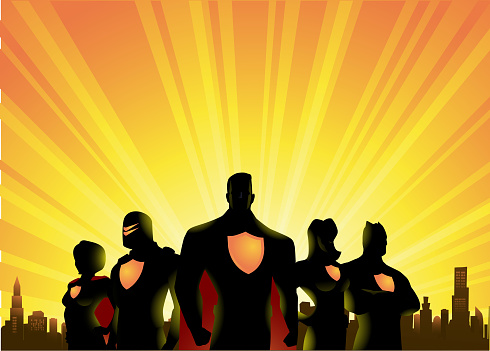 A vector silhouette illustration  of a team of superheroes, with sunrise and city skyline in the background. Wide space available for your copy.