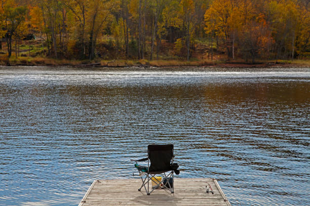 istock Ready for lake fishing on a dock in the Fall 953685812