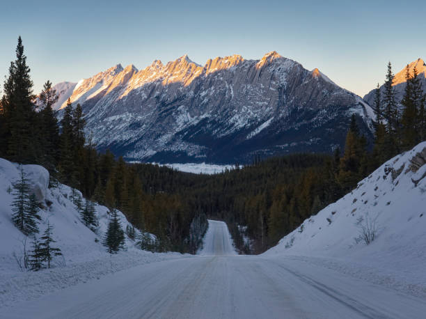 istock Snow Covered Road Leading into the Mountains 953686054