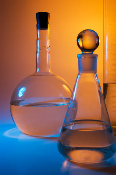 istock chemical glassware in multicolored lights 953691392