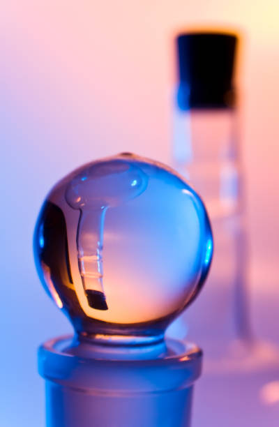 istock chemical glassware in multicolored lights 953691492