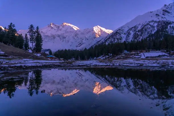 Photo of Reflection of Fairy meadows during the sunset period with  Nanga parbat mountain range , gilgit-baltistan , Pakistan