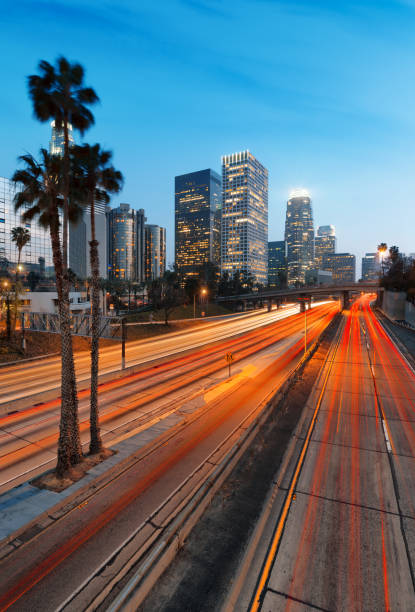 City of Los Angeles California at sunset with light trails stock photo