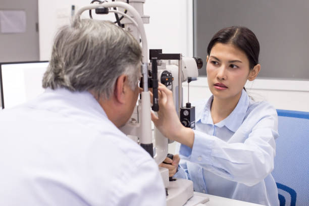 istock Female doctor using machine for check old man eye. People with medical concept. 953708272