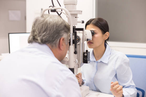 istock Female doctor using machine for check old man eye. People with medical concept. 953708404