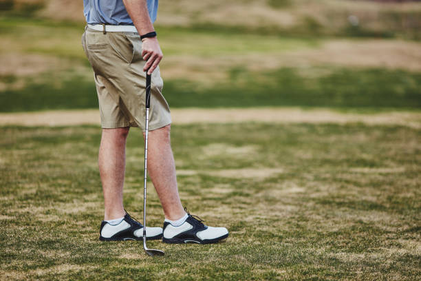 istock Male golfer wearing fitness tracker while playing golf 953708724