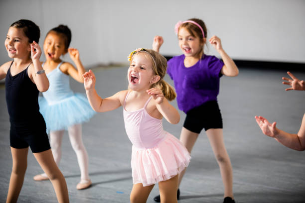 Diverse Young Students in Dance Class A diverse young group of students practice in musical theatre and ballet combo dance class theater industry stock pictures, royalty-free photos & images