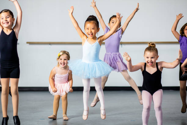 Diverse Young Students in Dance Class A diverse young group of students practice in musical theatre and ballet combo dance class theater class stock pictures, royalty-free photos & images