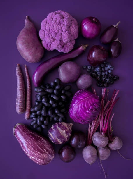 Purple fruits and vegetables Looking down on monochrome purple fruits and vegetables onion photos stock pictures, royalty-free photos & images