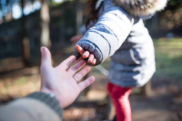 istock Parent and child playing in the park 953709744