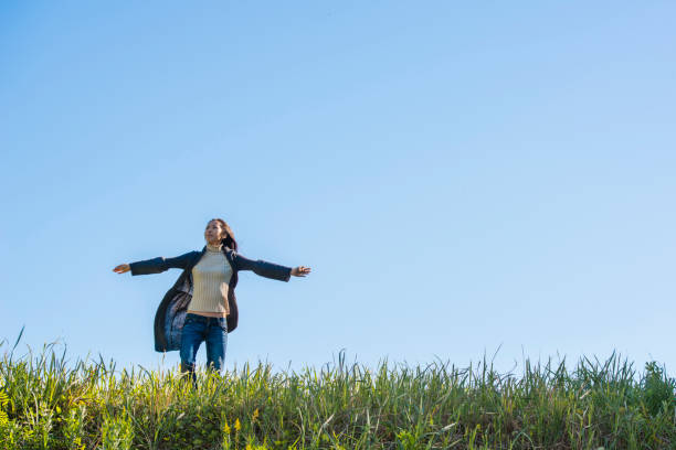 istock A woman looking up to the sky 953712122