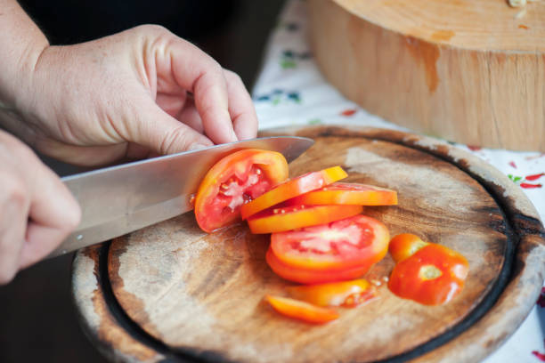 istock Cook is shredded tomato In the kitchen 953721696