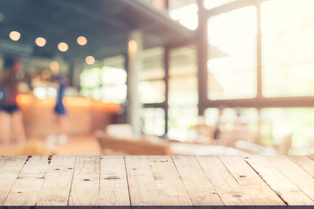 istock Empty wood table and Blurred background : Customer at coffee shop blur background with bokeh, Vintage toned. 953723388