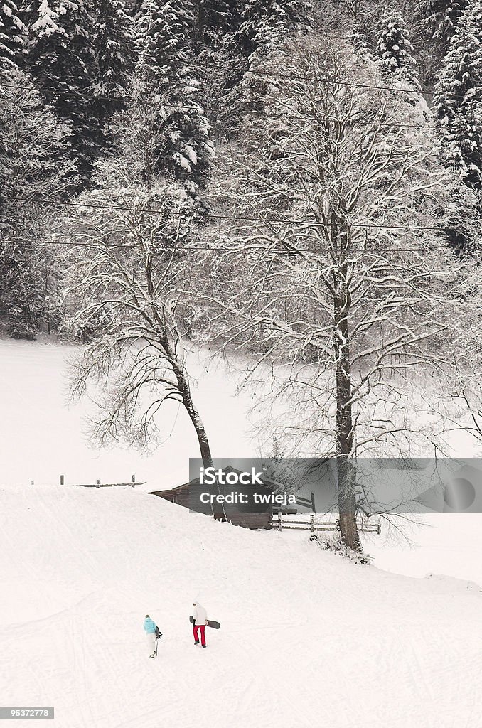 Snowboarder arrampicata una collina - Foto stock royalty-free di Adolescente