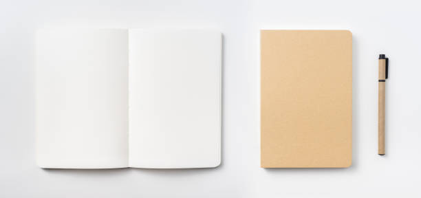 istock Top view of hardcover kraft notebook and ballpoint pen 953732148