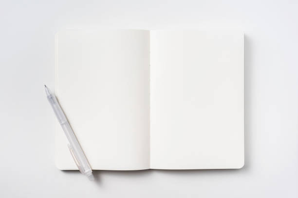 istock Top view of notebook blank page and ballpoint pen 953732336