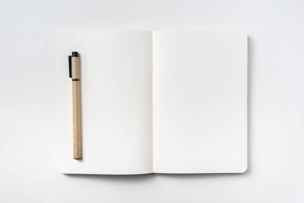istock Top view of notebook blank page and ballpoint pen 953732488