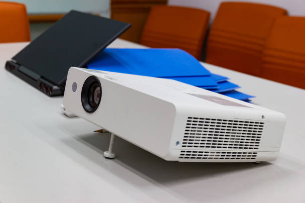 istock projector connected to Laptop on for presentation in a meeting room 953736642