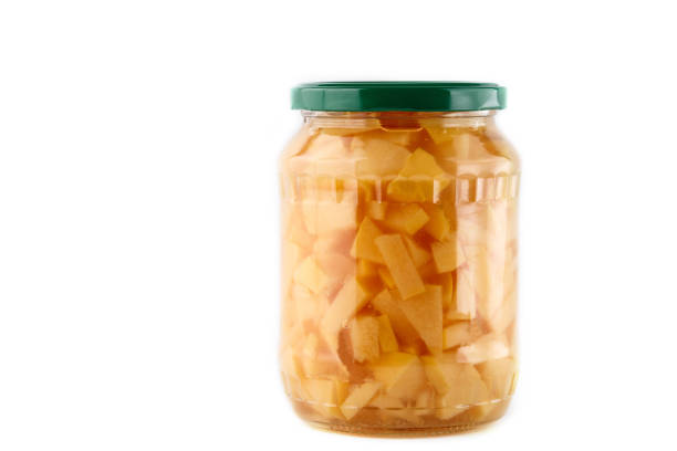 homemade quince jam in glass jar on white background. Isolated