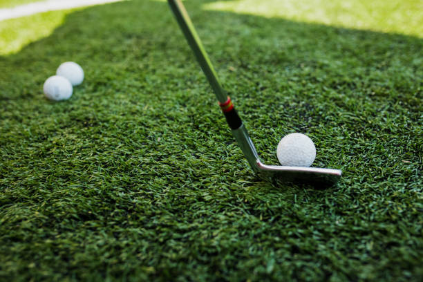istock Golf stick and ball on green grass 953740916