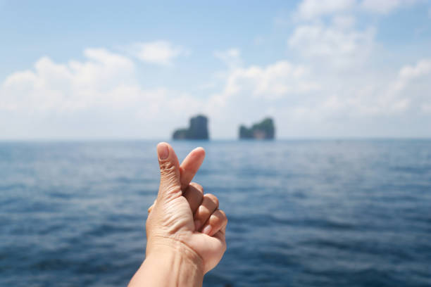 istock A hand making gesture of mini heart. 953741218